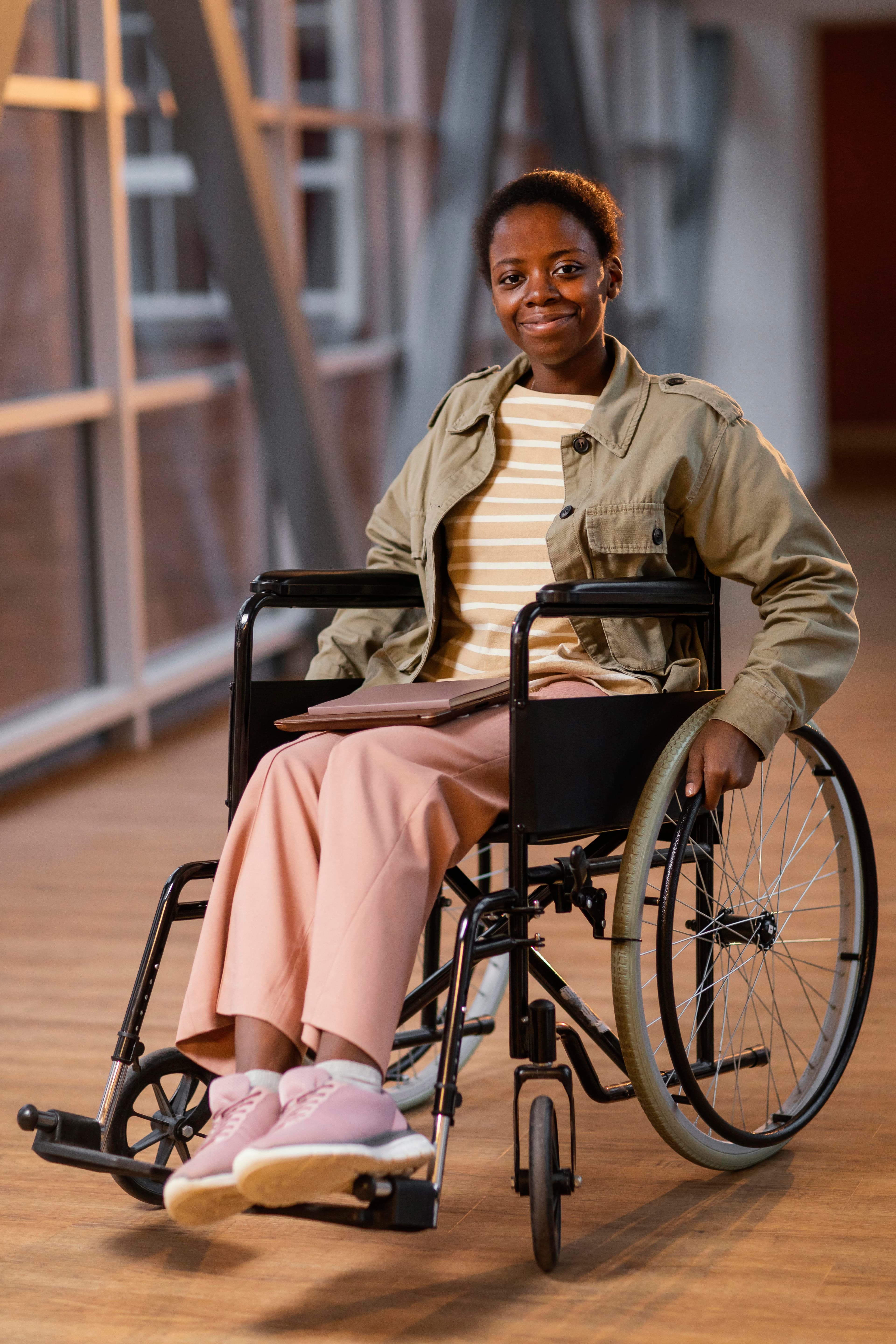 Student smiling in a wheelchair at school